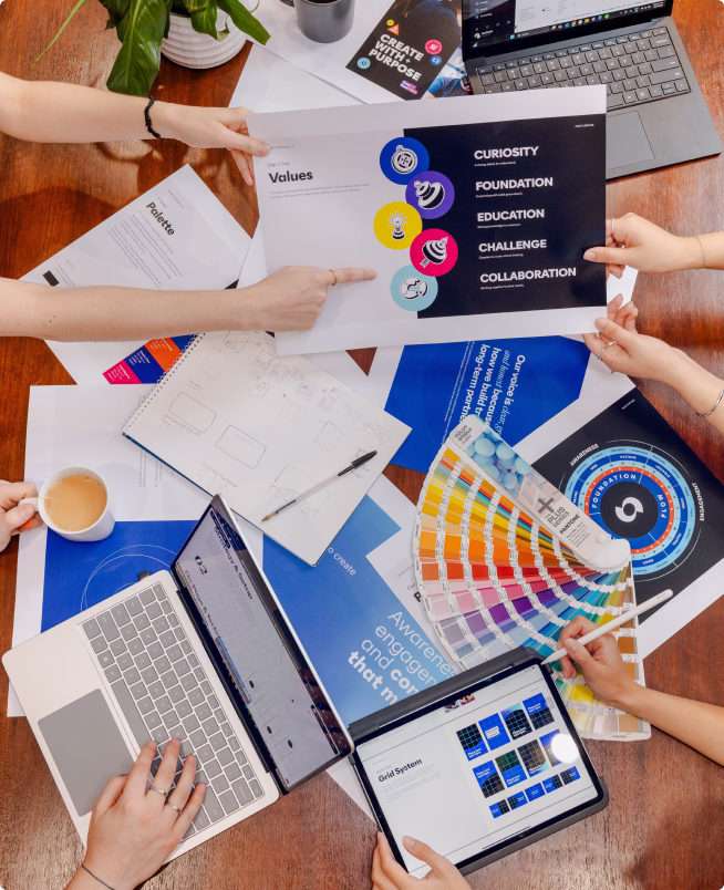 Overhead view of Optimise Online team working on brand values and colour palette design